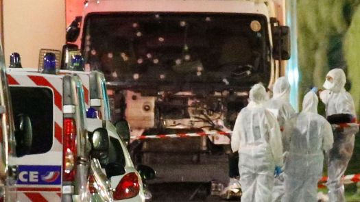 french-police-forces-and-forensic-officers-stand-next-to-a-truck-that-ran-into-a-crowd-celebrating-the-bastille-day-national-holiday-on-the-promenade-des-anglais-killing-at-least-60-people-in-nice-1_5638141